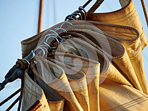 Details of gathered sail of a large sailing ship