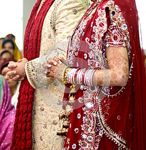 Details of groom`s and bride`s wear at the punjabi wedding,