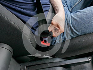 Details of hand putting on safety belt