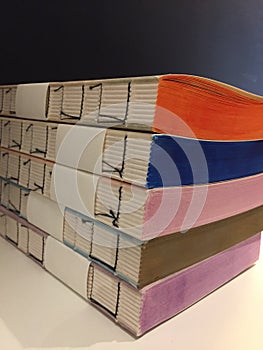 Details of handmade books of different multi colored papers. Notebooks.