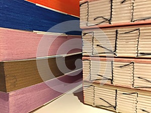 Details of handmade books of different multi colored papers. Notebooks.