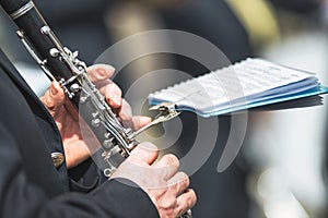 Details of hands playing the clarinet