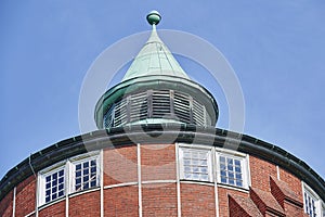 Details of a historic red brick water tower built around 1900 in Berlin