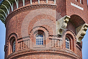 Details of a historic red brick water tower built around 1900 in Berlin
