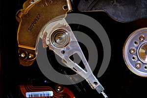 Details of inside computer hard drive showing read write arm