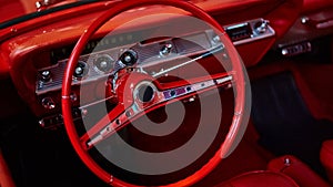 Details of interior classic car. Classic car steering wheel