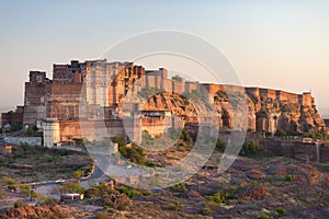 Details of Jodhpur fort at sunset. The majestic fort perched on top dominating the blue town. Scenic travel destination and famous