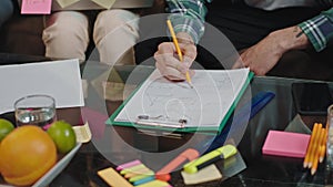 Details in the main office young worker details make some notes on the paper using a pencil louts of office things on