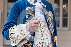 The details of man dressed in a baroque costume