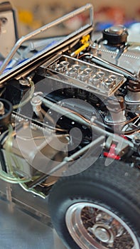Details of a miniature sports car engine bay