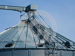 Details of modern granary elevator. Silver silos