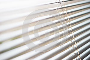 Details of the modern interior blinds on the window.