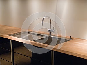 Details of modern kitchen sink with tap faucet