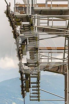 The details of a new ski lift, cable way. Support pole, rope, wheels, steps, steel construction