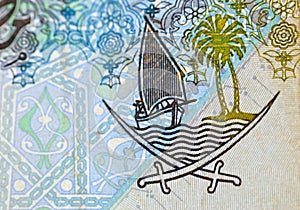 Details from the obverse side of 1 Qatari Riyal cash money currency of Qatar banknote features Ornated column, arches, sailboats,