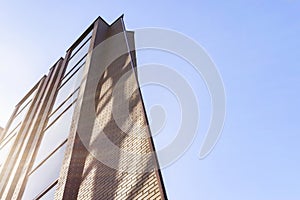 Details of office building exterior. Business buildings skyline looking up with blue sky. Modern architecture apartment. High tech