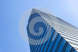 Details of office building exterior. Business buildings skyline looking up with blue sky. Modern architecture apartment. High tech