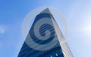 Details of office building exterior. Business buildings skyline looking up with blue sky. Modern architecture apartment. High tech