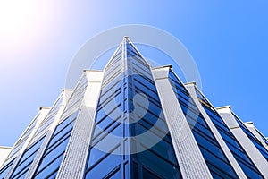 Details of office building exterior. Business buildings skyline looking up with blue sky. Modern architecture apartment. High tech