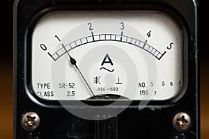 Details of an old black analog ampere meter