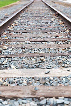Details of Old Train Tracks with Rocks and Wooden Railroad Ties