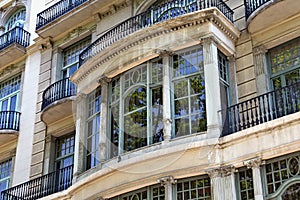 Details of the one of typical old buildings in modern style in the historical center of Barcelona in sunny day. Spain