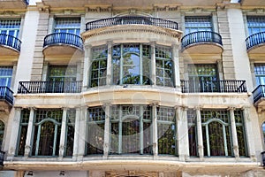 Details of the one of typical old buildings in modern style in the historical center of Barcelona in sunny day. Spain