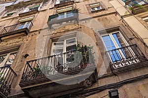 Details of the one of typical old residential buildings in the historical center of Barcelona in sunny day. Spain