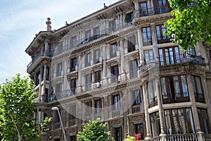 Details of the one of typical old residential buildings in modern style in the historical center of Barcelona in sunny day. Spain