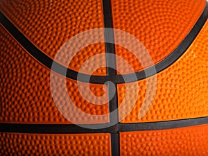 Details of an orange basketball. Macro shot. There are no people in the photo. Abstract Sports games, workouts, healthy lifestyle