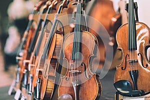 Details with parts of violins before a symphonic classical concert photo