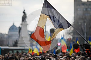 Details with the Romanian flag with a hole, the symbol of the Romanian Revolution from December 1989