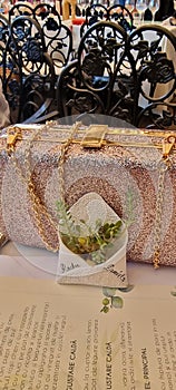 Details from romanian wedding with glittery purse and wedding keepsake