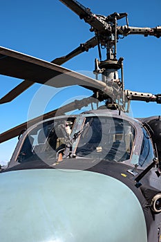 Details of the rotor and part of the body of modern military helicopters closeup.