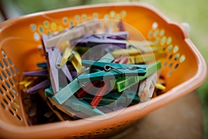 Details with a stack of plastic clothes pegs