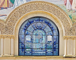 Details of stone carving and stained glass window