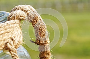 details straw rope knot on green background