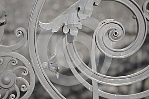 Details of structure and ornaments of wrought iron fence.