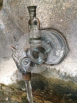 Old tap on a street in Andorra photo