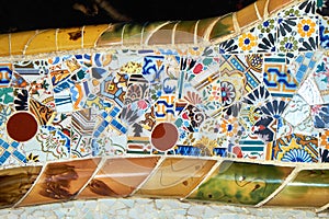 Details of trencadis mosaic of the ceramic serpentine bench at the central terrace of Park Guell designed by Antoni