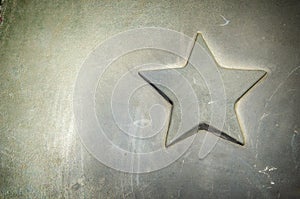 Details of a vintage car close-up. Details of military equipment. Metal star adorning the hood of a vintage armored