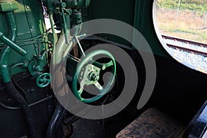 Details of a vintage steam train driving cabin.