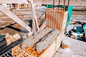 Details of wall building during house construction. bricklaying and mortar