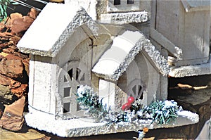 Details of a wooden house that decorates a Christmas tree photo