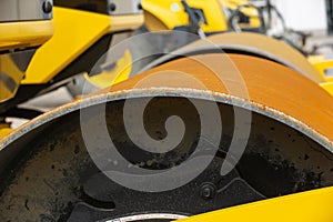 details of a yellow road roller