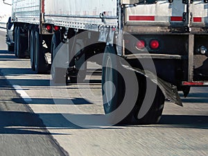 DetailsTracker trailers drive cautiously on icy roads