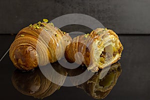 Detail of an open pistachio croissant photo