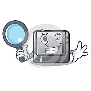 Detective button K in the cartoon shape