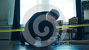 Detective Collecting Evidence in a Crime Scene. Forensic Specialists Making Expertise at Home of a Dead Person. Homicide