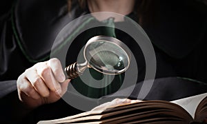 Detective magnifying glass, criminal or tax investigation concept